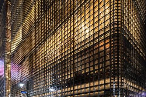 Exterior view of the illuminated facade of Maison Hermès, Ginza, Tokyo, Japan — travel photo of Japan