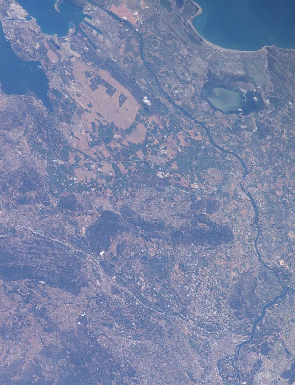 ISS009-E- - View of France - Rhône River - Alpilles mountain ridge - Avignon - river Durance - Cavaillon - Luberon - Saint-Martin-de-Crau - Arles - Camargue - Etang de Vaccarès (cropped) — travel photo of Arles, Provence — Avignon & the Luberon