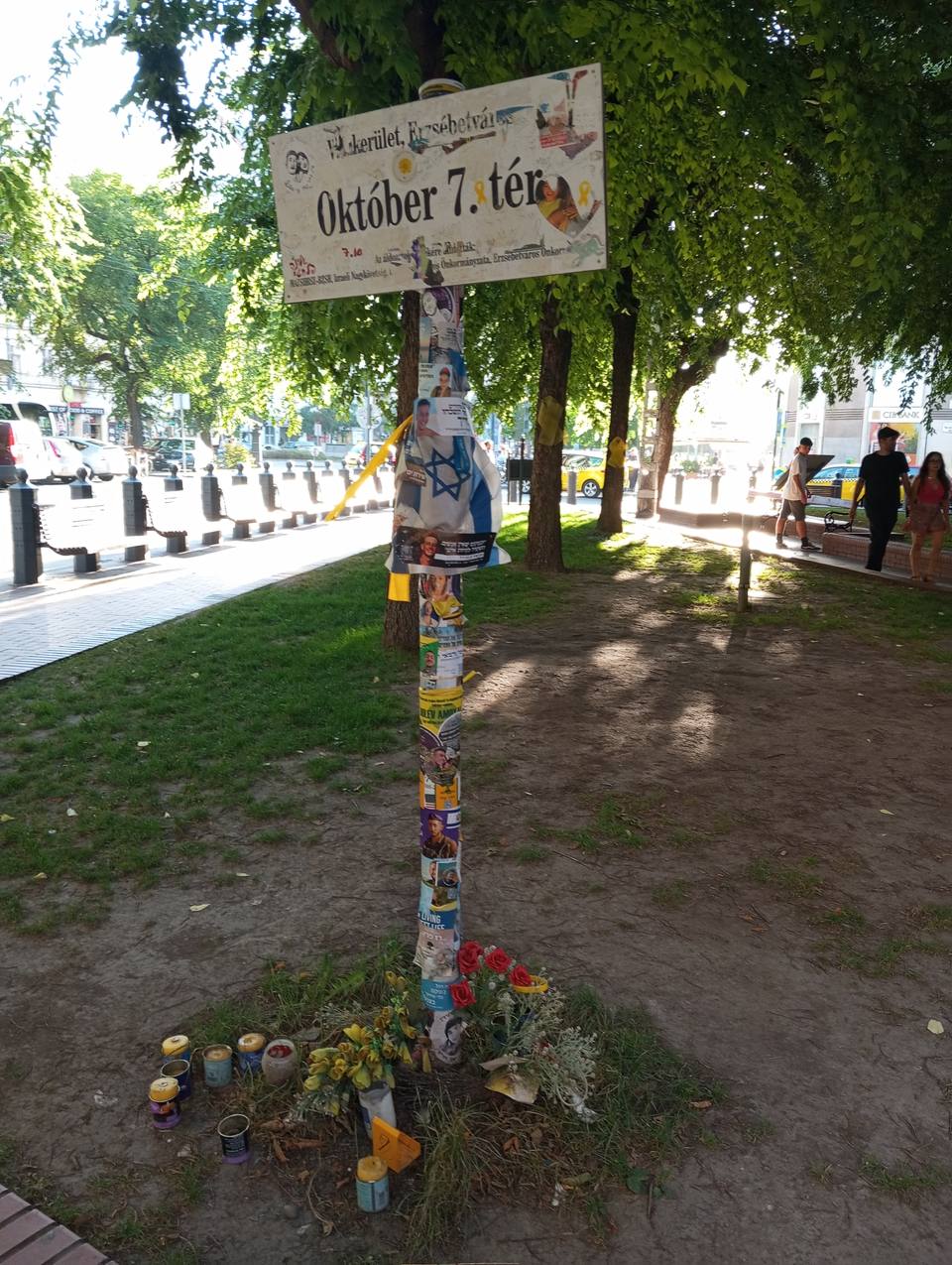 Sticker on a sign of October 7th Square in Jewish Quarter of Budapest ( — travel photo of Jewish Quarter, Budapest