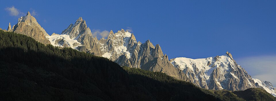 Wide view to Aiguilles de Chamonix & Aiguille du Midi from Les Praz — travel photo of Aiguille du Midi, Chamonix & Mont Blanc