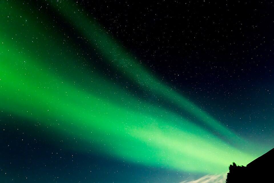 Aurora Borealis from the rooftop in Iceland — travel photo of Aurora borealis Iceland, Iceland