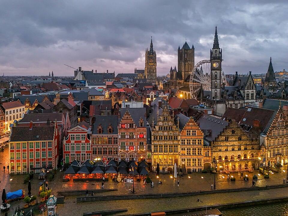 Graslei, Clock tower of the Post Office, Church of Saint-Nicolas in Ghent and Belfry of Ghent Photo by Giles Laurent — travel photo of Graslei, Ghent