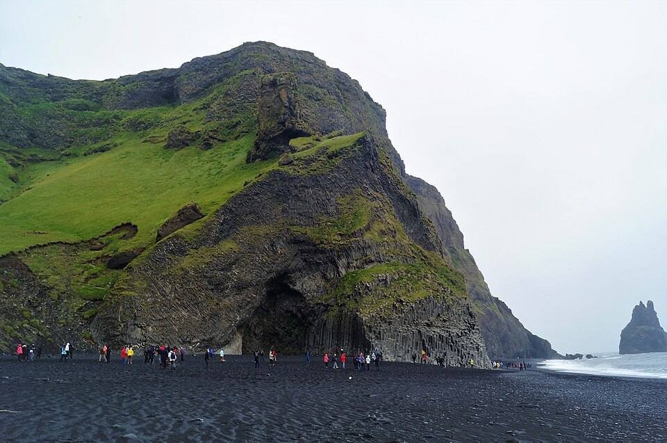 Mountain and grotto at Reynisfjara Beach in July — travel photo of Reynisfjara