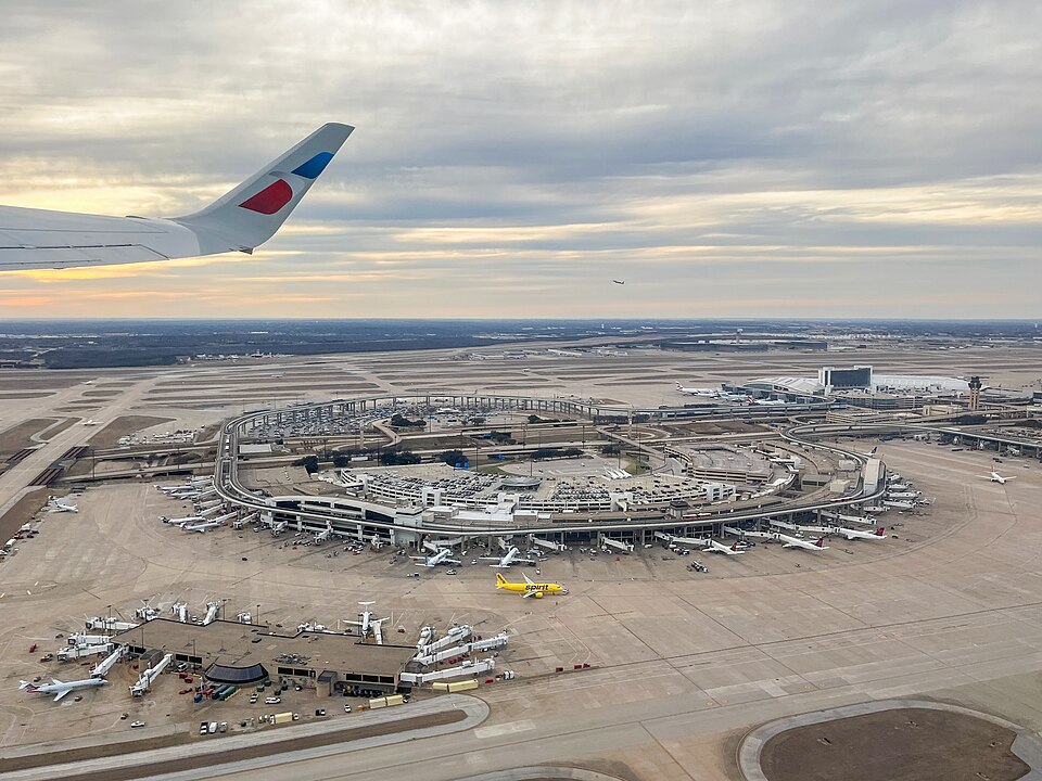 Terminal E at Dallas Fort Worth International Airport, aerial view from cabin window during takeoff — travel photo of Fort Worth, Dallas