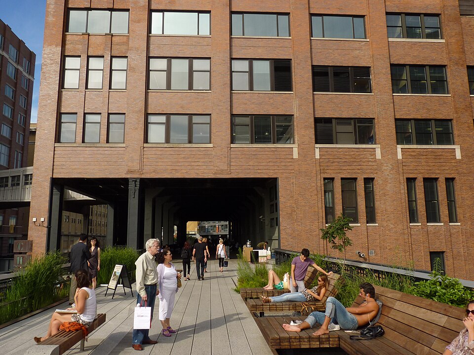 The high line runs under chelsea market building — travel photo of Chelsea & the High Line