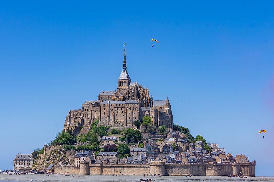 Soldiers from Army Golden Knights jump at Mont Saint- Michel Normandy, France for D-Day commemoration ceremonies ( ) — travel photo of Normandy — Mont-Saint-Michel & D-Day, France